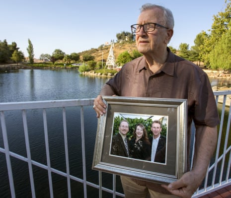 Frank Kerrigan holds a photograph of his three children – John, Carole and Frank.