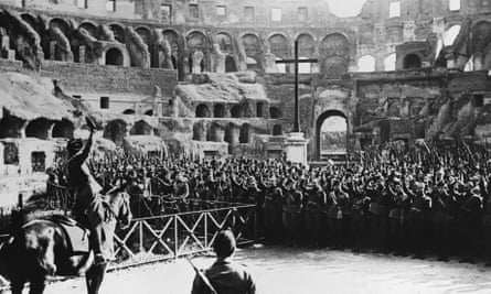 Mussolini greets the fascist militia in the Colosseum, Rome, in 1930.