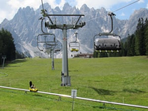 Mini bobsleighs at San Candido in front of Haunold mountain, South Tirol, Italy.