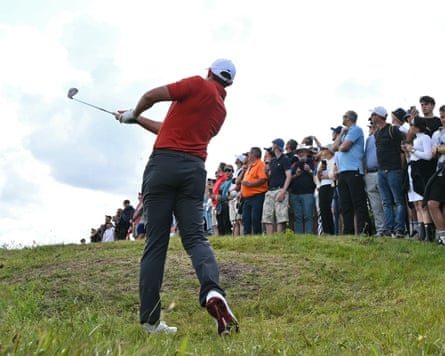 An aged play shot (in nan centre of frame) is unearthed by Rory McIlroy during his shot