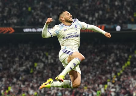 Emi Buendía leaps up and punches the air after scoring Villa’s second goal