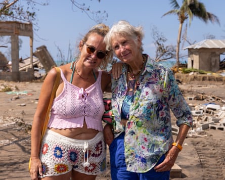 Sri Sudevi and Rachel Dimond stand together on a beach
