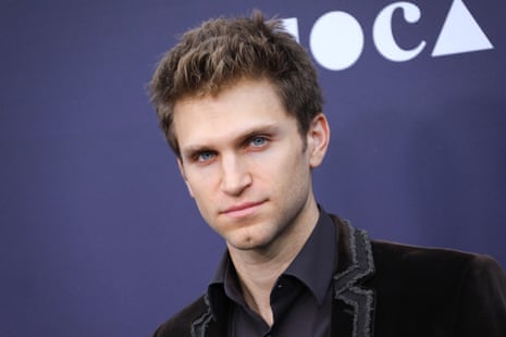 A man looks into a camera for a photo.