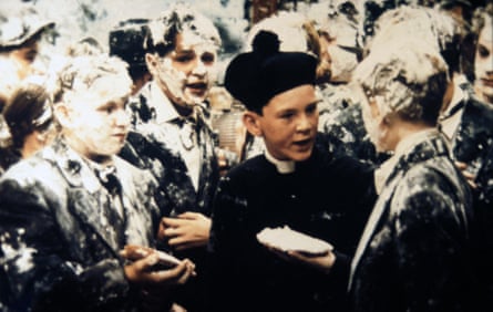 Boys wearing suits are covered in white goo