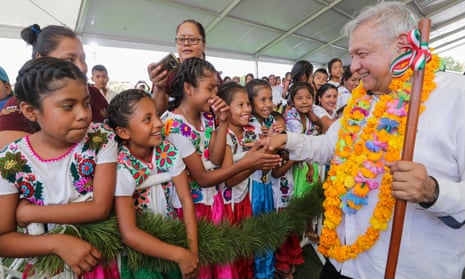 Mexico’s president, Andrés Manuel López Obrador, shakes hands with children while visiting towns in the south-western state of Guerrero.