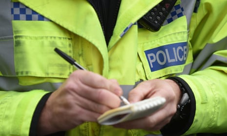police officer writing in notebook
