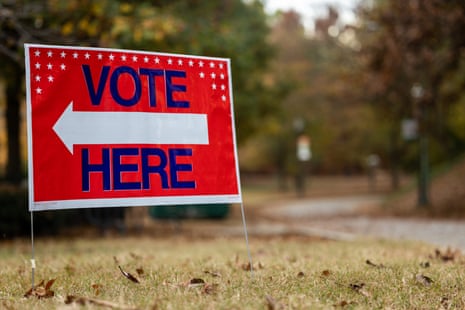 A 'Vote Here' sign.