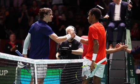 Canada's Felix Auger-Aliassime shakes hands with Britain's Jack Draper after winning his singles match.