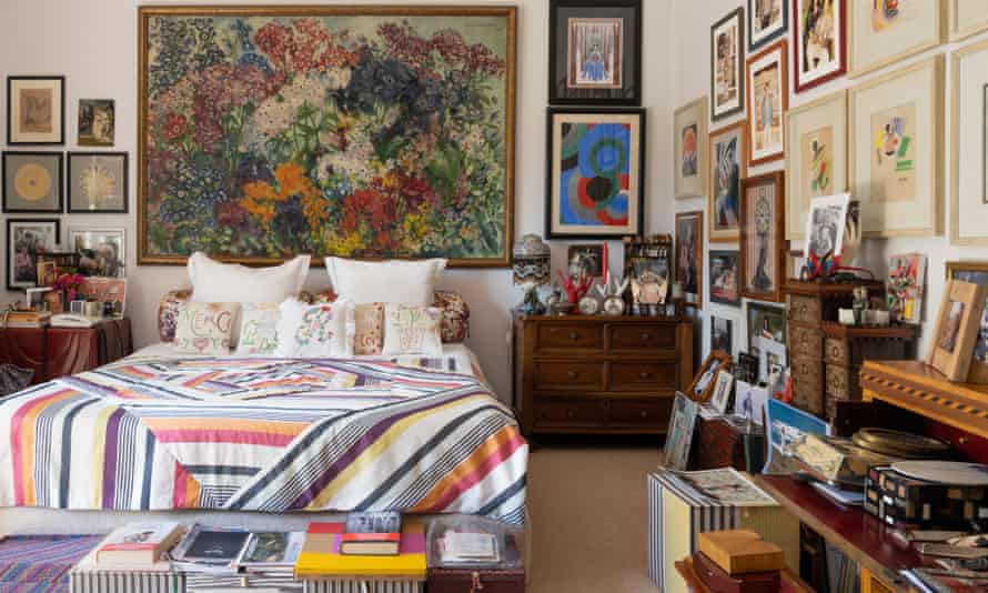 Numerous paintings jostle for space in Rosita’s bedroom.