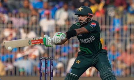 Pakistan’s captain Babar Azam stretches to play a shot on his way to his half-century.