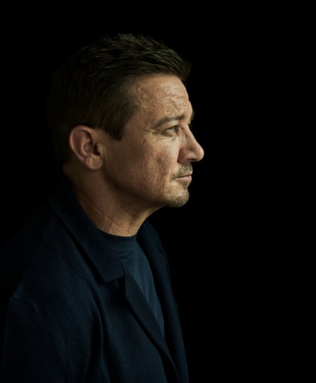 Portrait of Jeremy Renner with the side of his face in profile
