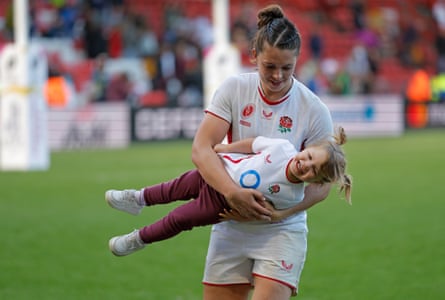 Abbie Ward carries her daughter, Hallie.