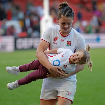 The England lock Abbie Ward plays with her two-year-old daughter Hallie on the pitch after the Women’s Rugby World Cup 2025 semi-final against France.