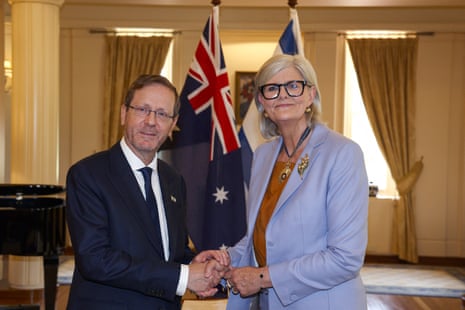 Sam Mostyn shakes hands with Israeli president Isaac Herzog after a welcome ceremony at Government House