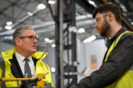 Starmer speaking to a worker at BAE Systems' shipyard in Govan, Glasgow.