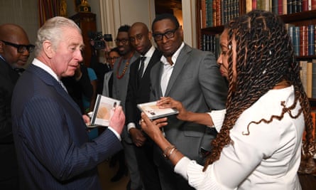 Presenting the then Prince Charles with one of her CDs at The Powerlist at Clarence House, 1 March 2022.