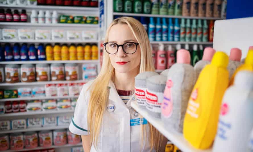 Artist Lucy Sparrow wears an ‘NFS’ white coat in her felt chemist’s shop