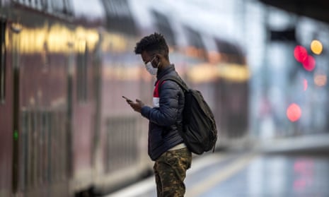A man waits for a train in Frankfurt