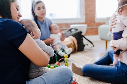 Diverse young mothers meet to support each other.