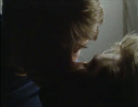 A closeup of two young men kissing