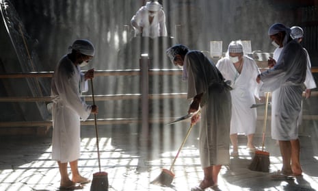 Buddhist monks clean the dust from the 15-meter-high Great Buddha at the Todaiji Temple in Nara, Japan.