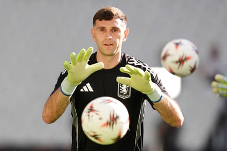 Emiliano Martinez attempts to catch a ball