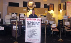 An employee of a liquidation company waits for customers.