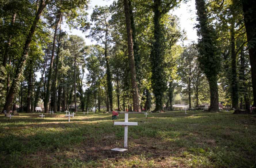 The Tucker family cemetery has more than 104 markers, with burials dating to the 1800s. The white crosses are unmarked graves which were identified by ground penetrating radar.