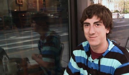 Young man at a cafe pavement table