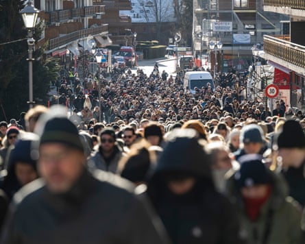 A crowd of people walking together