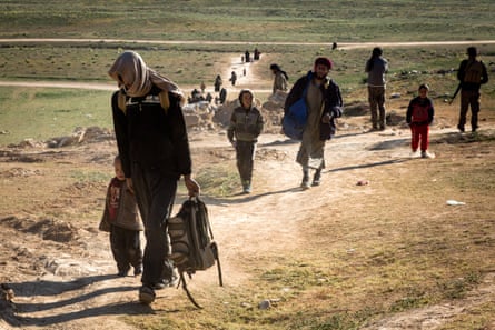 Civilians arrive at an SDF forward screening point on 12 February 2019.