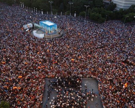 Thousands of people gather at the Palacio de Cibeles, seat of the Madrid City Council, in Madrid.