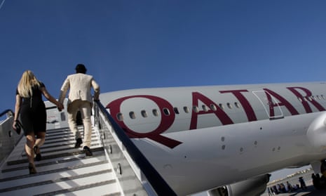 Passengers board a Qatar Airways’ Boeing 777-200LR, which may be used for the new Auckland and Santiago routes.