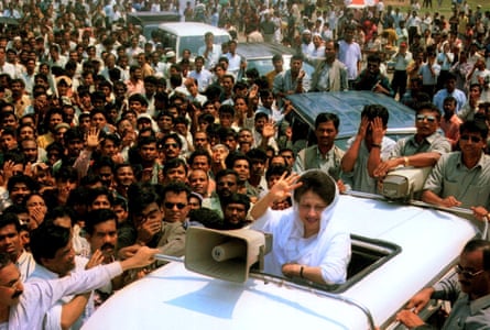 Khaleda Zia waves to a crowd from a vehicle