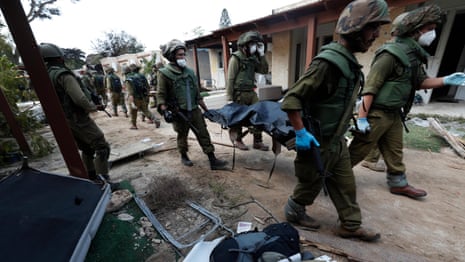 Israel: bodies recovered from villages infiltrated by Hamas along Gaza border – video report