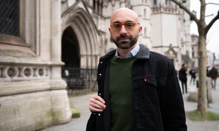 Carlo Palombo with a bag over his shoulder outside the Royal Courts of Justice