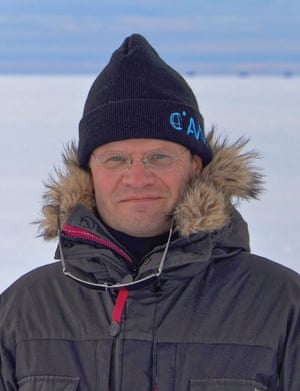 markus rex standing in coat and hat with a snowy horizon behind him