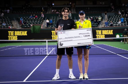 Taylor Fritz and Elena Rybakina pose with their trophies after winning the Eisenhower Cup Tie Break Tens event