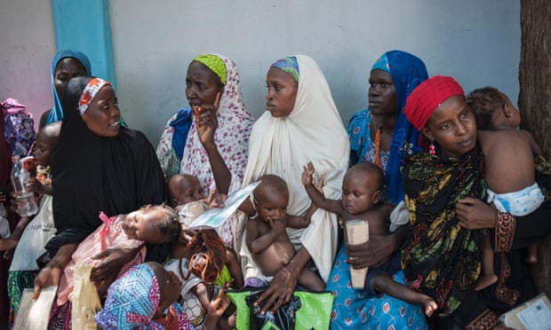 Mothers and their children waiting for a checkup at a health facility in Maiduguri, north-east Nigeria.