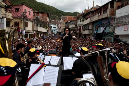 Gustavo Dudamel performs with the Simon Bolívar Youth Symphonic Orchestra during a free concert in La Vega, Caracas, in 2009.