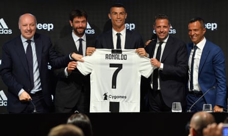 Fabio Paratici (second right) enjoys the signing of Cristiano Ronaldo for Juventus in 2018.