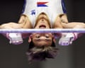 A male gymnast competes on a horizontal bar