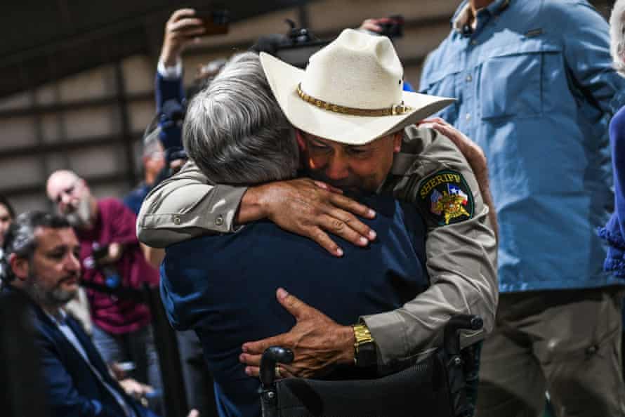Uvalde County Sheriff Ruben Nolasco hugs Texas Governor Greg Abbott as they attend a vigil for the victims.