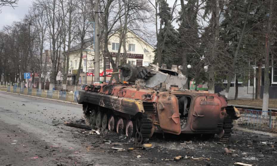 A destroyed armoured personnel carrier stands in the central square of the town of Makariv