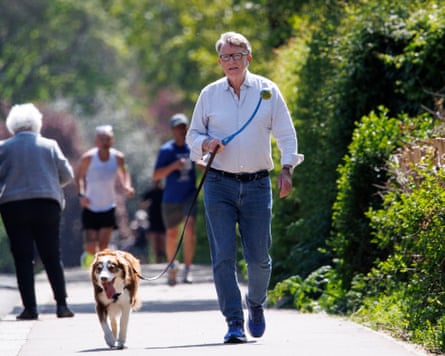 Peter Mandelson walking his dog in a London park