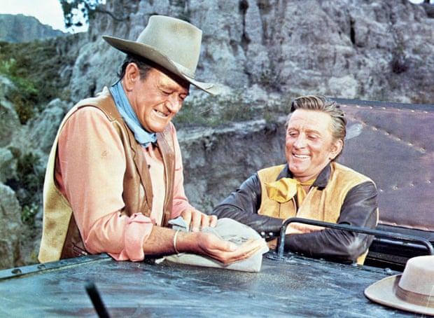 Douglas (right) with John Wayne in the 1967 film The War Wagon.