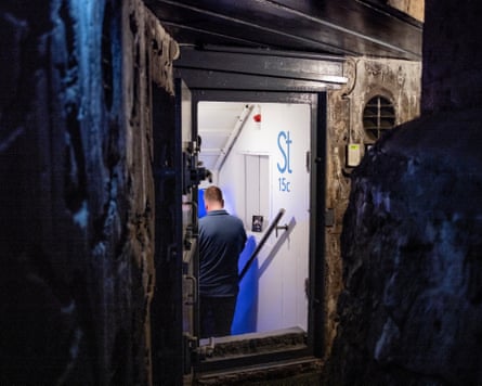 A small metal door is open to the entrance to the bunker museum in Bodø.