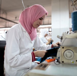 An employee at her sewing machine on the factory floor of a textile factory 2011 in Tangier, Morocco