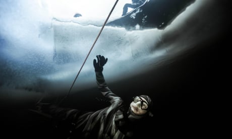 Descending the icy depths: free-diving under ice sheets - in pictures