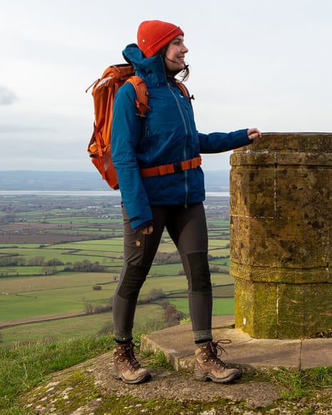The writer wearing a Tierra jacket and Lowa boots on top of a hill